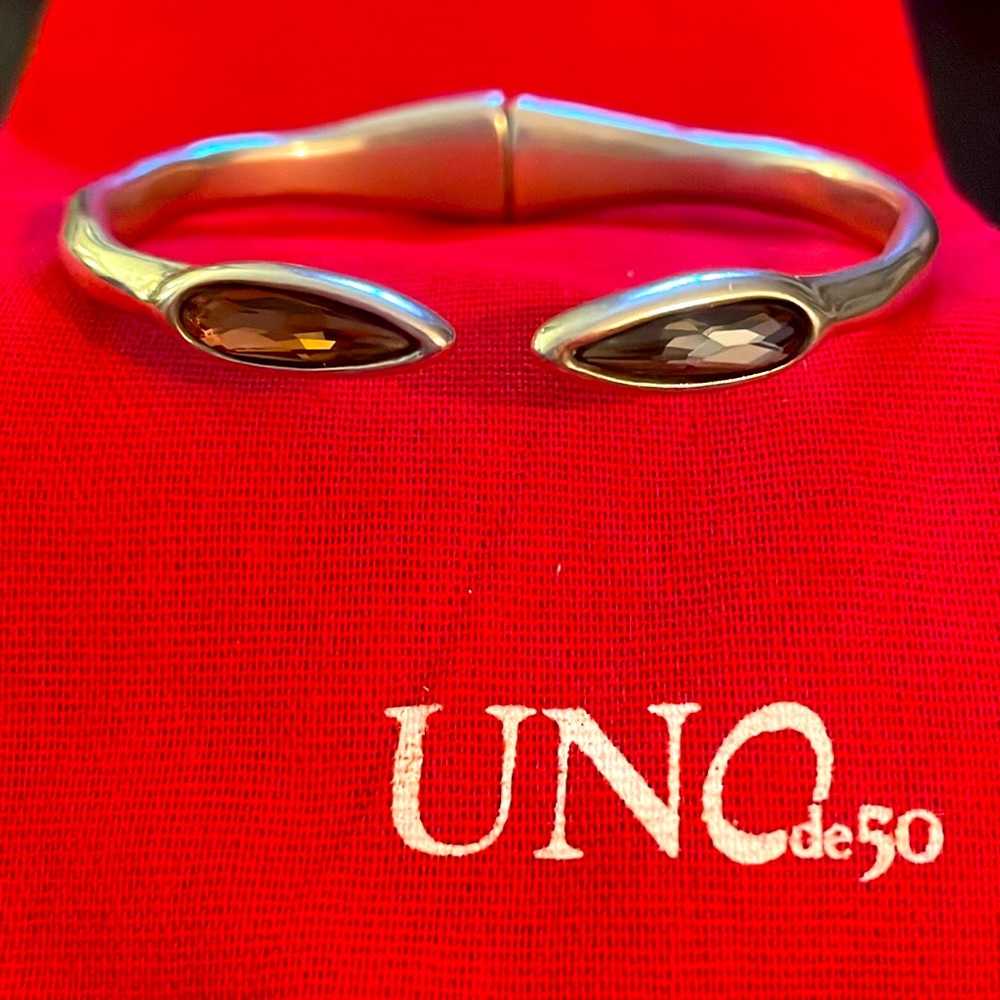 UNODE50  hinged silver bracelet with a pink and a grey stone. size M EUC
